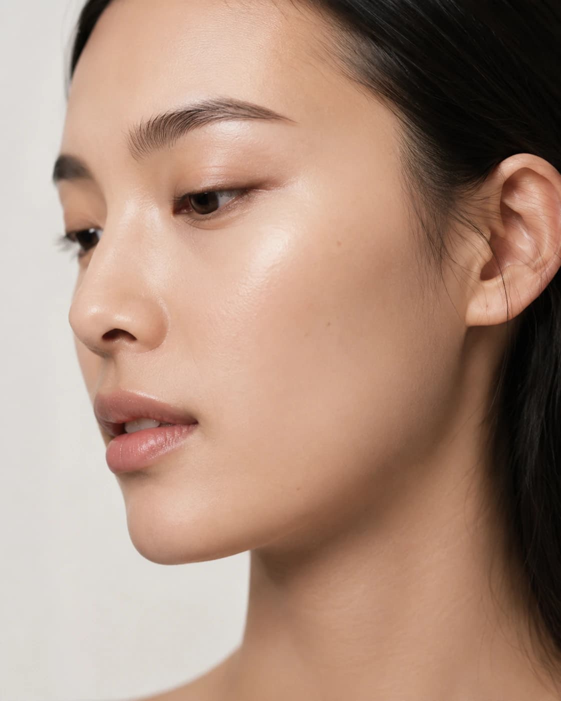 Editorial portrait crop focused on relaxed brow and eyes.